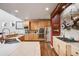 Gourmet kitchen featuring stainless steel appliances, tile countertops, and ample wood cabinetry offers a modern aesthetic at 13324 W 86Th Dr, Arvada, CO 80005