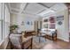 Comfortable living room featuring hardwood floors, coffered ceiling, and tasteful decorations at 13324 W 86Th Dr, Arvada, CO 80005
