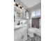 Bright bathroom featuring a white vanity, decorative tile floor, and a medicine cabinet at 4501 Bryant St, Denver, CO 80211