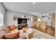 Cozy living room featuring a leather couch, wooden coffee table and an area rug at 4501 Bryant St, Denver, CO 80211