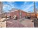 Backyard patio area with a grill, outdoor seating, and stylish string lights at 4501 Bryant St, Denver, CO 80211