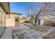 Landscaped backyard with mature tree and shed at 8408 W 62Nd Pl, Arvada, CO 80004