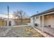 Backyard featuring fenced yard, mature tree and shed at 8408 W 62Nd Pl, Arvada, CO 80004