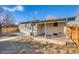 Rear exterior of home featuring a covered patio at 8408 W 62Nd Pl, Arvada, CO 80004