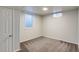 Basement with small window and neutral paint and carpet at 8408 W 62Nd Pl, Arvada, CO 80004