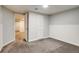 Basement area with multiple doors, and neutral paint and carpet at 8408 W 62Nd Pl, Arvada, CO 80004