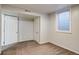 Basement area with neutral paint, carpet and a small window at 8408 W 62Nd Pl, Arvada, CO 80004