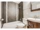 Modern bathroom featuring a bathtub with shower and a stylish vanity at 8408 W 62Nd Pl, Arvada, CO 80004