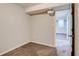 Bedroom with neutral carpeting and adjacent room at 8408 W 62Nd Pl, Arvada, CO 80004