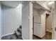 Hallway with stairwell and a refrigerator closet at 8408 W 62Nd Pl, Arvada, CO 80004