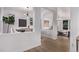 An open dining area features modern lighting and seamlessly connects to the stylish living space at 2345 Akron St, Denver, CO 80238