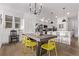 Open kitchen and dining area with modern appliances and stylish countertops at 2345 Akron St, Denver, CO 80238