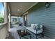 Relaxing front porch offers comfortable seating and neighborhood views at 2345 Akron St, Denver, CO 80238