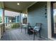 Relaxing front porch offers comfortable seating and neighborhood views at 2345 Akron St, Denver, CO 80238