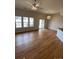 Open-concept living room with hardwood floors and natural light at 15217 Xenia, Thornton, CO 80602