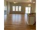 Bright and airy living room with hardwood floors, and a kitchen island at 15217 Xenia, Thornton, CO 80602