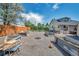 Large backyard featuring garden boxes, fire pit, and seating areas at 1775 Longbranch St, Strasburg, CO 80136