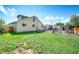 Lawn and backyard area with sheds, bicycles and a garden at 1775 Longbranch St, Strasburg, CO 80136