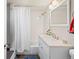 Neat bathroom with a shower, vanity, and classic fixtures at 1775 Longbranch St, Strasburg, CO 80136