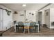 Cozy dining room featuring a farmhouse-style table, decor, and barn door at 1775 Longbranch St, Strasburg, CO 80136