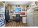 Spacious office area with natural light, desk, storage, safe, and unique decorative artwork at 1775 Longbranch St, Strasburg, CO 80136