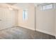 Finished basement bedroom with light walls, window, and large closet at 2310 Willow Creek Dr, Golden, CO 80401