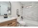 Updated bathroom featuring modern fixtures, stylish tile, and a shower-tub combo at 2310 Willow Creek Dr, Golden, CO 80401