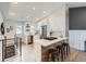 Modern kitchen featuring white cabinets, stainless steel appliances, and a breakfast bar at 2310 Willow Creek Dr, Golden, CO 80401