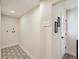 Mud/Laundry room with patterned tile floors, light walls, and side door at 2310 Willow Creek Dr, Golden, CO 80401