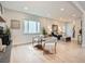 Bright living room featuring wood floors, stylish seating and an accent wall at 2310 Willow Creek Dr, Golden, CO 80401