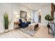 Cozy living room featuring a blue sofa, patterned rug, and modern decor at 2310 Willow Creek Dr, Golden, CO 80401