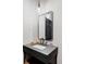Modern bathroom with an elegant vanity, pendant lights, and a sleek mirror at 1 Sedgwick Dr, Cherry Hills Village, CO 80113
