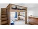 A unique bedroom design with stairs to a lofted bed, desk, and blue accents at 1 Sedgwick Dr, Cherry Hills Village, CO 80113