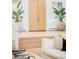 Entryway with a wooden door, tiled floor, and planters at 1 Sedgwick Dr, Cherry Hills Village, CO 80113