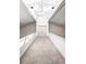 Bright hallway featuring a skylight, chandelier lighting, and neutral carpet at 1 Sedgwick Dr, Cherry Hills Village, CO 80113