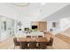 Spacious living room and dining area with hardwood floors, a fireplace, and an open floor plan at 1 Sedgwick Dr, Cherry Hills Village, CO 80113