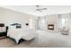 Light and bright main bedroom with a fireplace, plush carpet, and stylish furnishings at 1 Sedgwick Dr, Cherry Hills Village, CO 80113