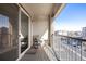 Private balcony with rocking chairs and view at 14351 E Tennessee Ave # 305, Aurora, CO 80012