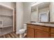 Bathroom with toilet, vanity, and walk-in closet at 14351 E Tennessee Ave # 305, Aurora, CO 80012