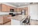 Modern kitchen with stainless steel appliances and an island at 14351 E Tennessee Ave # 305, Aurora, CO 80012