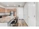 Modern kitchen with stainless steel appliances and an island at 14351 E Tennessee Ave # 305, Aurora, CO 80012