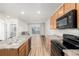 Open kitchen with stainless steel appliances and an island at 14351 E Tennessee Ave # 305, Aurora, CO 80012