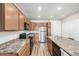 Modern kitchen with stainless steel appliances and an island at 14351 E Tennessee Ave # 305, Aurora, CO 80012