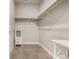 Large walk-in closet with double hanging rods and shelving at 14351 E Tennessee Ave # 305, Aurora, CO 80012