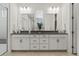 Elegant bathroom showcasing dual vanities, sleek countertops, and contemporary fixtures for a spa-like experience at 11103 Cloud Shadow St, Littleton, CO 80125