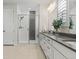 Stylish bathroom features a glass-enclosed shower, contemporary fixtures, and a serene color palette for relaxation at 11103 Cloud Shadow St, Littleton, CO 80125