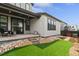 Lovely backyard with artificial lawn, rock accents, and a patio for outdoor enjoyment at 11103 Cloud Shadow St, Littleton, CO 80125
