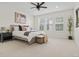 Relaxing main bedroom with a ceiling fan, ample natural light, and neutral decor for a serene atmosphere at 11103 Cloud Shadow St, Littleton, CO 80125