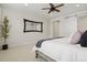 This spacious main bedroom has light walls, light carpeting, and a minimalist aesthetic with a large mirror at 11103 Cloud Shadow St, Littleton, CO 80125