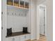 Mudroom with built-in bench, storage, and hooks at 11103 Cloud Shadow St, Littleton, CO 80125